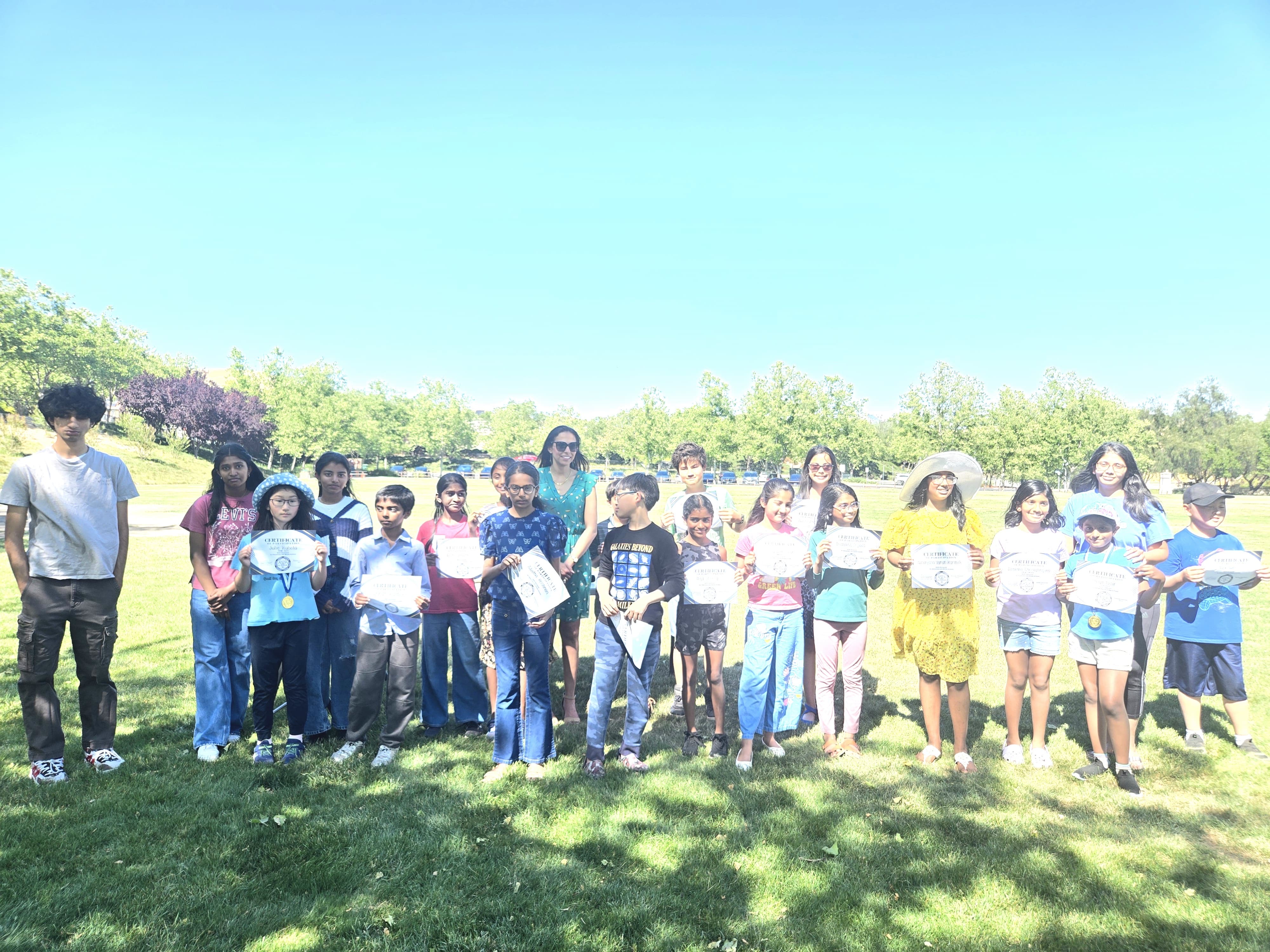 Group photo of all participants with certificates